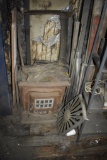 Antique indoor wood stove with two cooking surface plates
