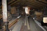 contents of upstairs of barn close to woods