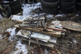 pallet with base board heaters that were never installed and old fashioned hand carts
