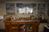 All kitchen related items under and above sink in cupboards and drawers