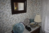 Group of dishes and small wall mirror