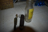 Thomas Edison Battery Oil Bottle and two knives
