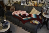 Green Sofa with Some Blankets