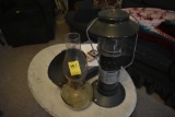 antique Gas Lamp with Light Reflecting Back and Coleman Propane Lantern