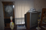 neat Clock with push lever, tube tv, bowling pin, and trophy