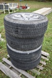 Four Bridgestone P285/45 R22 Tires On Five Lug Rims
