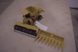 New Holland Combine with Corn and Grass Heads