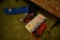 Little Blue camping chair with misc exercise weights and dirt devil vacuum