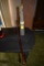 Glass bottle of Dirt from Poland circa 1966 and wooden cane with lacquer