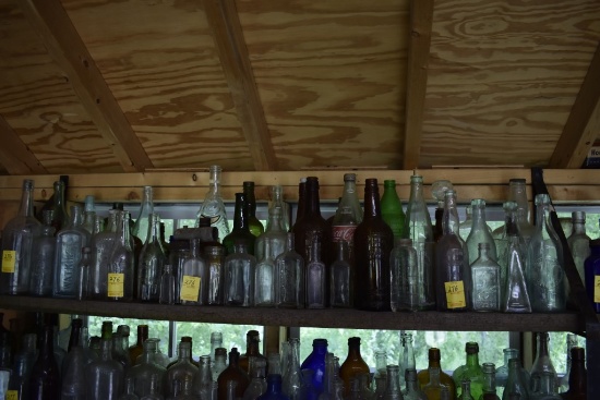 Shelf of Vintage Glass Bottles