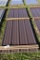 32 Pieces of 10' Sections of Brown Corrugated Metal Paneling