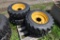 4 Forerunner 10-16.5 NHS Skid Steer Tires on 8 Lug Rims
