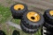 4 Forerunner 10-16.5 NHS Skid Steer Tires on 8 Lug Rims