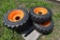 4 Forerunner 10-16.5 NHS Skid Steer Tires on 8 Lug Rims
