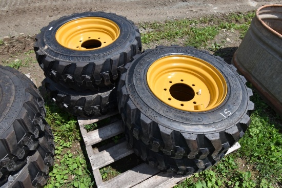 4 Forerunner 10-16.5 NHS Skid Steer Tires on 8 Lug Rims