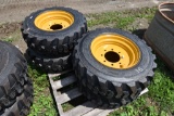 4 Forerunner 10-16.5 NHS Skid Steer Tires on 8 Lug Rims