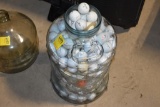 Glass Jug Full of Golf Balls