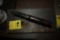 Large Bullet on a Wooden Plaque