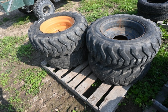 4 Titan 10-16.5 Tires on 8 Lug Rims