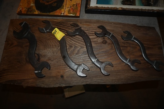Five Champion Wrenches on Wooden Plaque