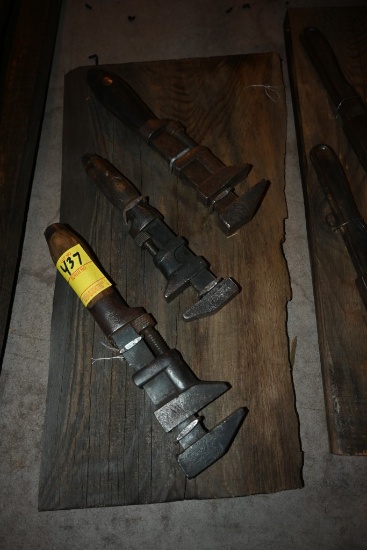 Three Vintage Adjustable Wrenches on a Wooden Plaque