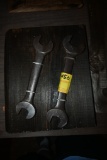 Two Wrenches on a Wooden Plaque