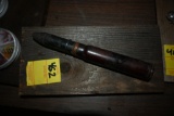 Large Bullet on a Wooden Plaque