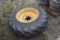Firestone 16.9-28 Tire on 8 Lug Rim