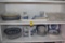 Two shelves of Blue and White China with some Glass Ware