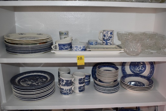 Two shelves of Blue and White China with some Glass Ware