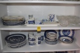 Two shelves of Blue and White China with some Glass Ware
