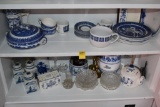 Two shelves of Blue and White China with some Glass Ware
