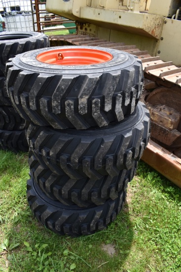 4 Solidmax 12-16.5 Tires on 8 Lug Rims