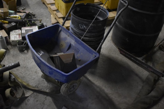Push Type Lawn Spreader and Piece of Plastic Drain Pipe