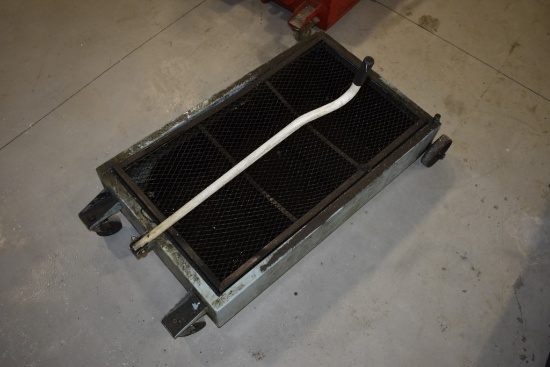 Under Truck Oil Pan on Wheels