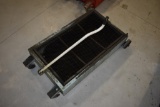 Under Truck Oil Pan on Wheels