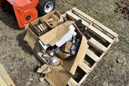 pallet of Chains and Exhaust Pieces for Chainsaws