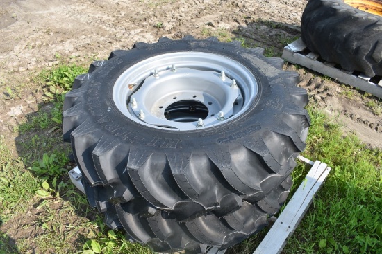 Pair of Titan 12.4-24 Tires on 8 Lug Rim
