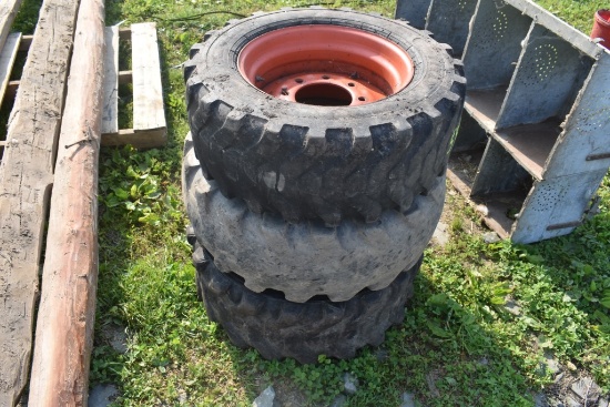 4 Used Skid Steer Tires on 8 Lug Rims