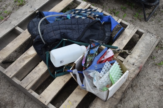 Pallet with Horse Blankets, Ear Tags, Bottle