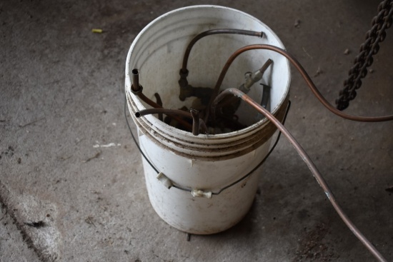 Bucket of Pipe Fittings and Some Copper Tubing