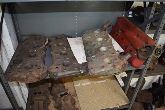 Shelf With Four Ford 8Ba Cast Iron Heads And One Misc Cast Iron Head