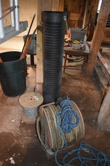 Corrugated Drain Pipe Partial Roll Of Barbed Wire Fence And A Roll Of Rope