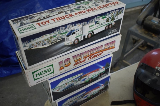 Four Hess Trucks