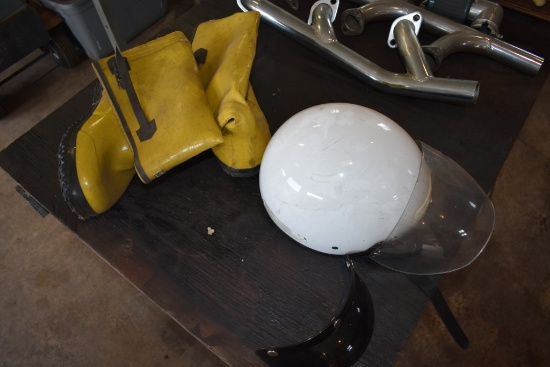 Motorcycle Helmet And A Pair Of Rubber Boots