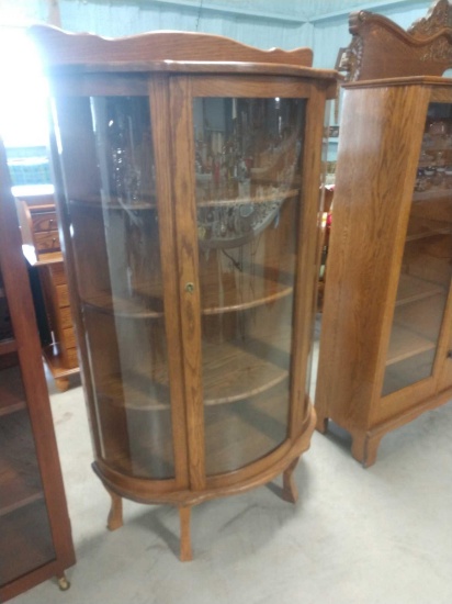 Round oak curio cabinet