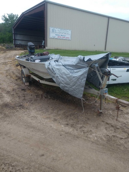 Flat bottom boat and trailer with Mercury motor