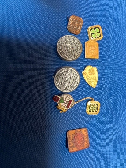 Lot of 9 advertising pins/buttons
