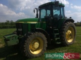 1999 John Deere 7810 Power Quad TLS 40kph tractor with front wafer weights and left hand reverser.