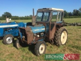 1976 Ford 3600 2wd tractor with cab on 6.00-16 front and 12.4/11-28 rear wheels and tyres. Reg No: